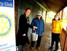 On cold and windy morning Michael Jefferys draws the winning tickets wit Alison Hayes of the Newmarket Journal.